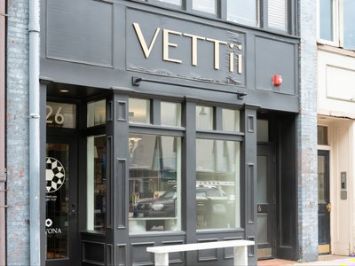 The VETTii showroom seen from Tremont Street, lit from within